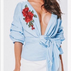 gorgeous wrap top with a trendy clip.